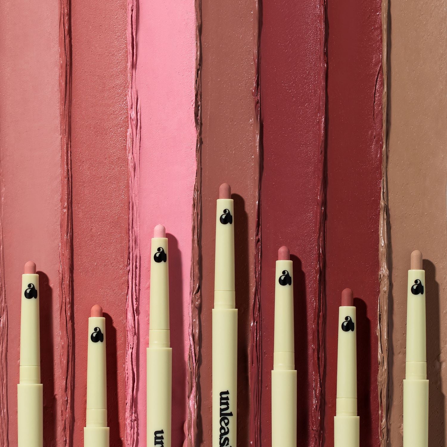 Unleashia Oh! Happy Day Lip Pencil lip liner in a neutral shade, shown with the pencil tip and product packaging.