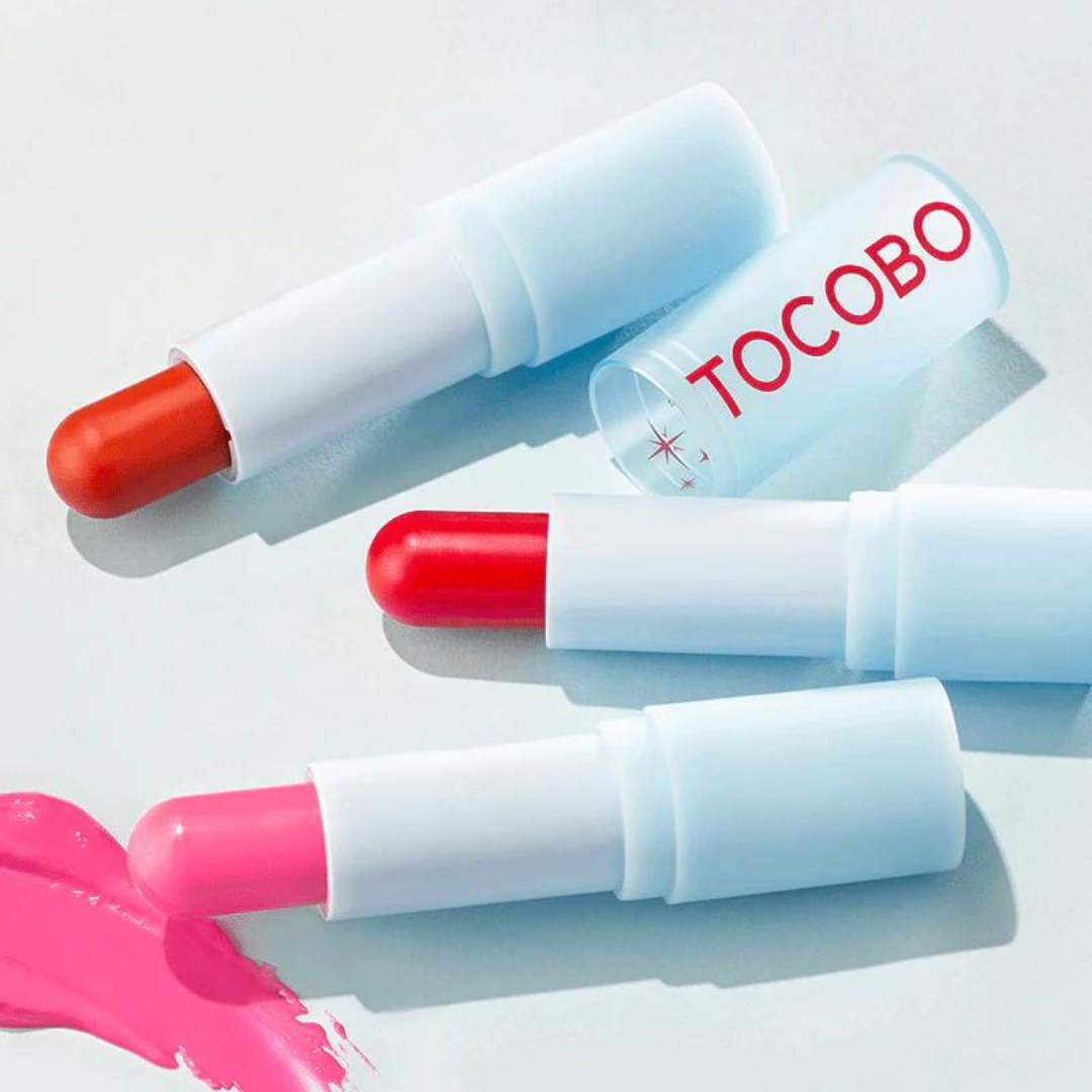 TOCOBO glass tinted lip balm and essence in a sleek container, showcasing the tinted balm inside with a smooth, glossy finish.