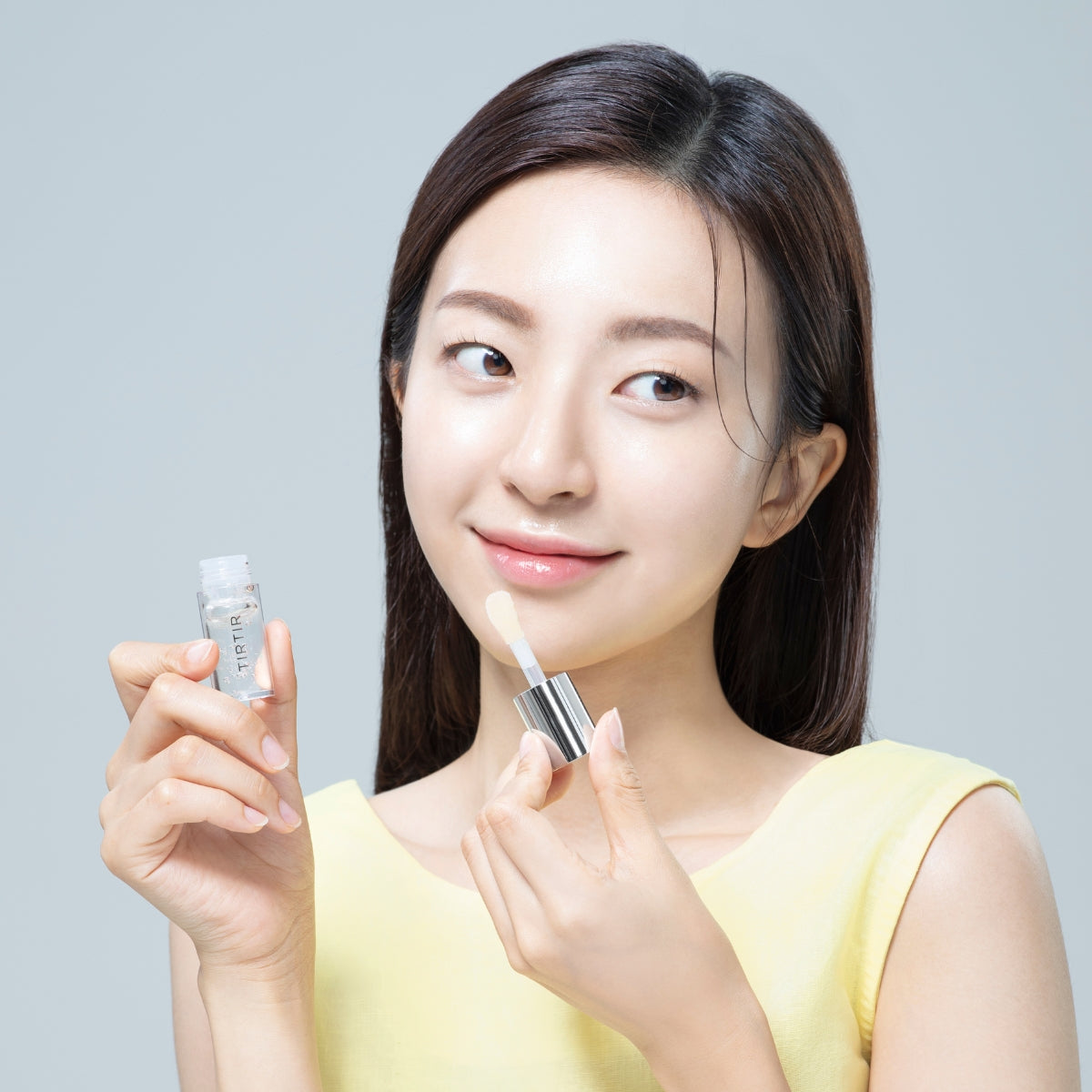TIRTIR My Glow Lip Oil Honey in a 5.7ml tube, glossy clear lip gloss with a honey-inspired shine and smooth applicator.