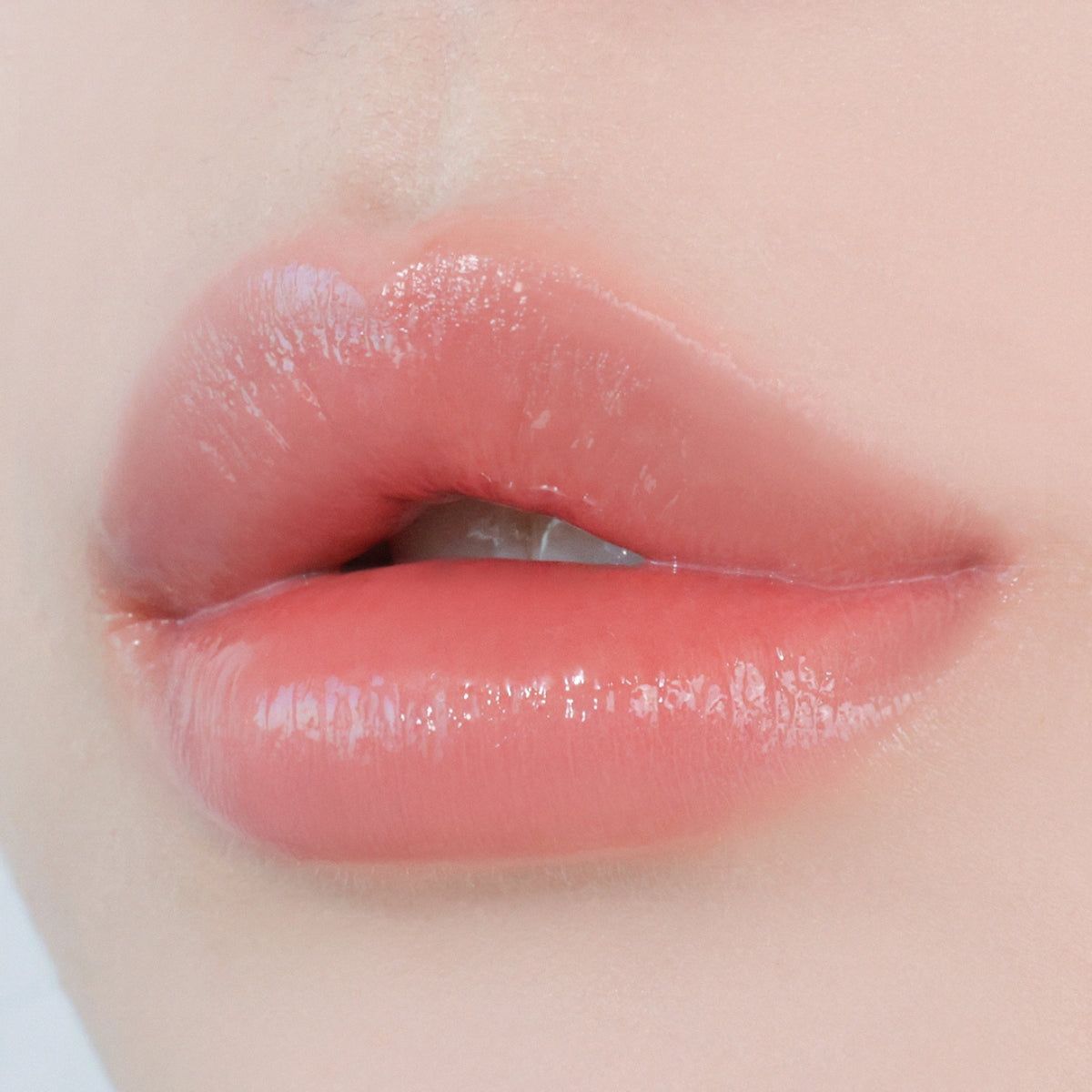 Sisua by Unleashia Berry Shot Lip Tint in a sleek tube with a doe-foot applicator and a vibrant berry-colored liquid.