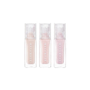 Wakemake Sheer Glow Liquid Highlighter in a glass bottle with a silver cap, showcasing a luminous, shimmering liquid highlighter.