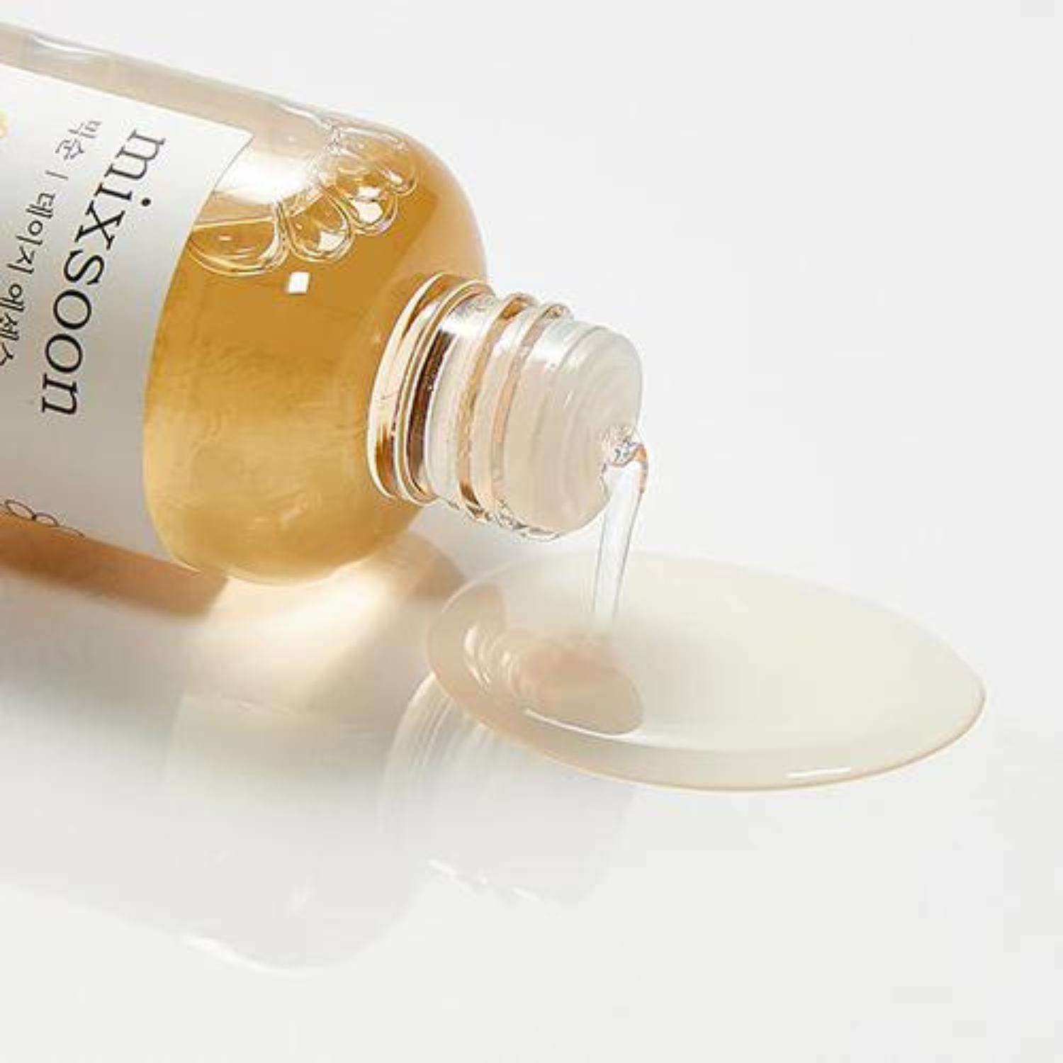 Mixsoon Daisy Essence 100ml bottle with clear liquid and floral label, showcasing natural skincare essence.