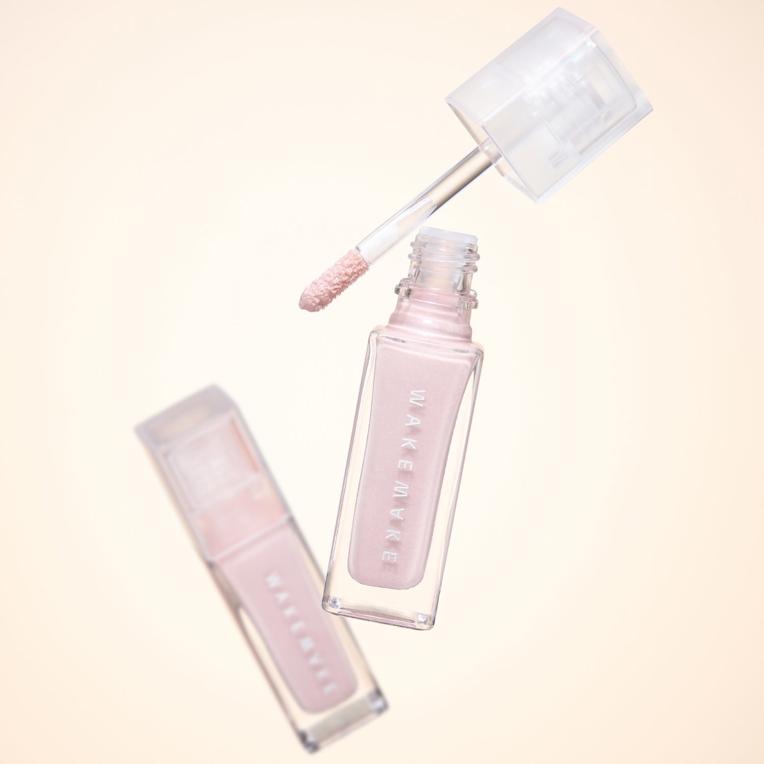 Wakemake Sheer Glow Liquid Highlighter in a sleek bottle, showcasing a radiant, luminous liquid highlighter for glowing skin.