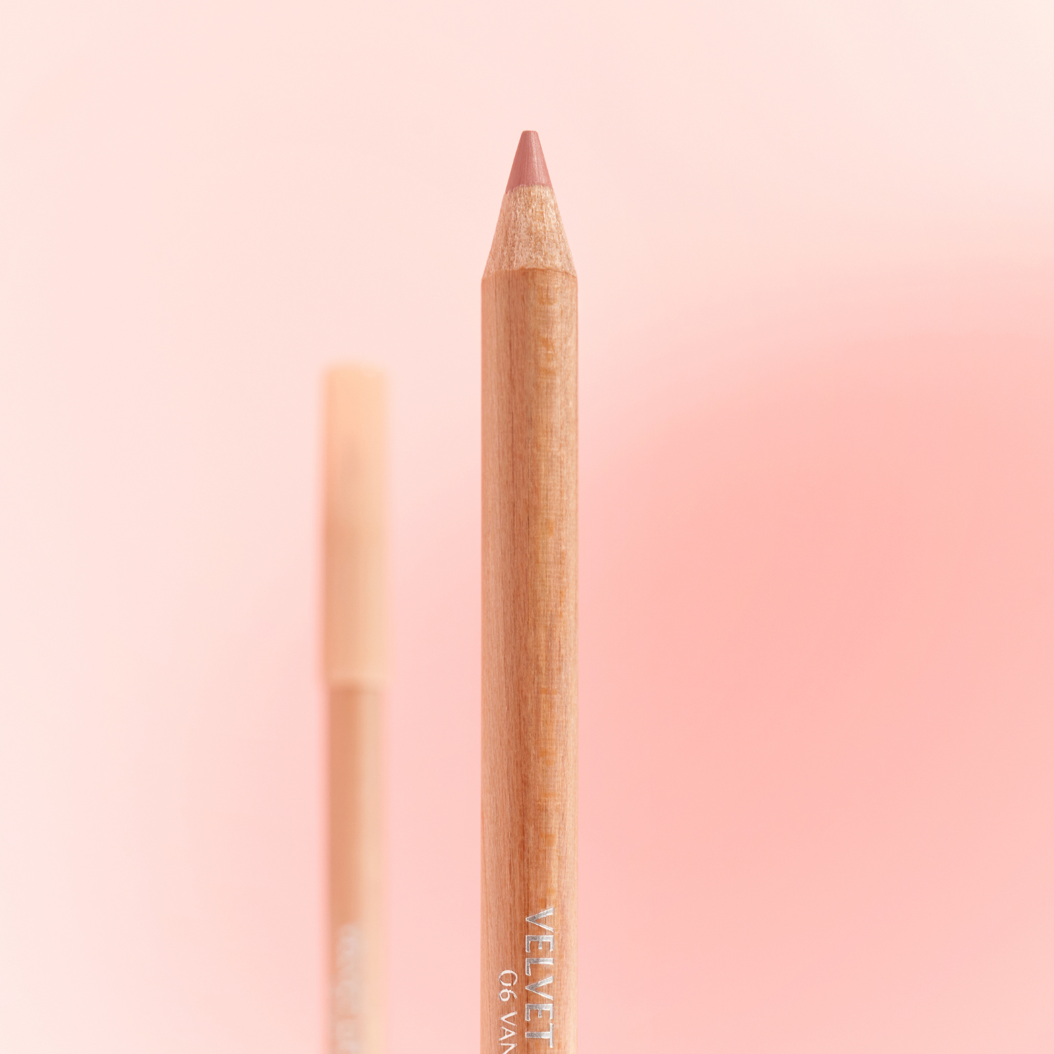 Clio Velvet Lip Pencil Set with five lip liner pencils in various shades, featuring sleek black packaging and colorful tips.