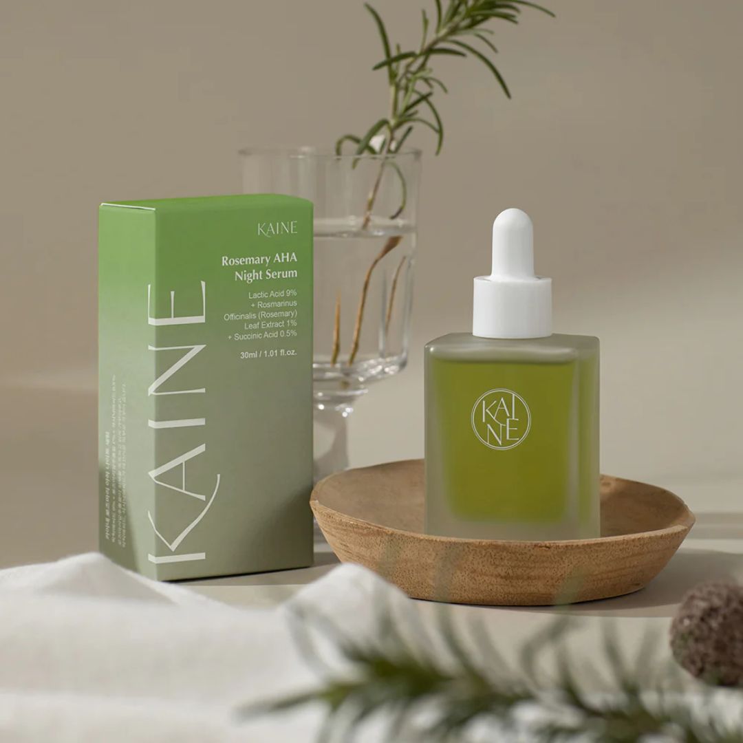 KAINE Rosemary AHA Night Serum 30ml bottle with dropper, featuring a sleek design and clear labeling on a white background.
