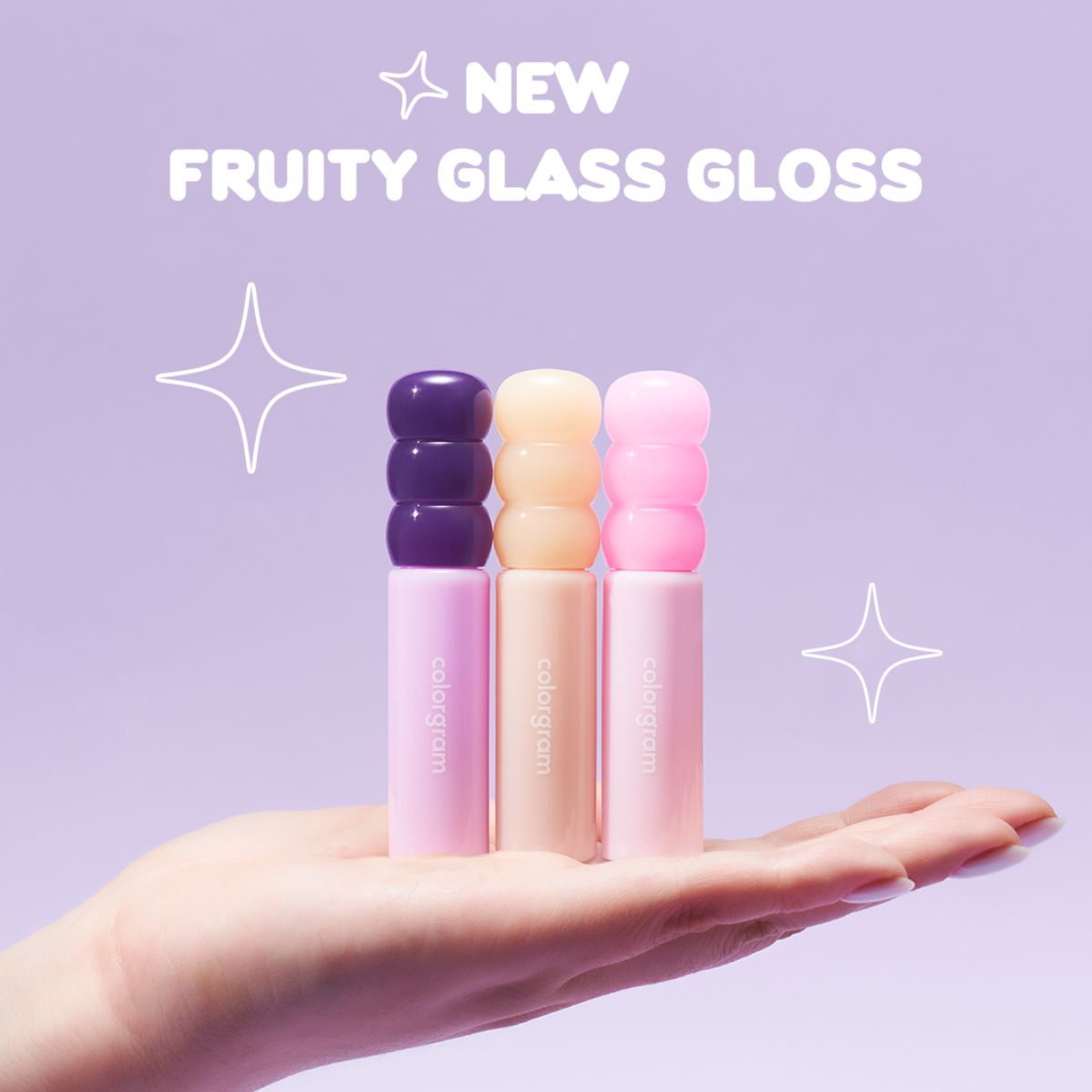Colorgram Fruity Glass Gloss Lip Tint in a clear tube with vibrant pink and orange shades visible inside.