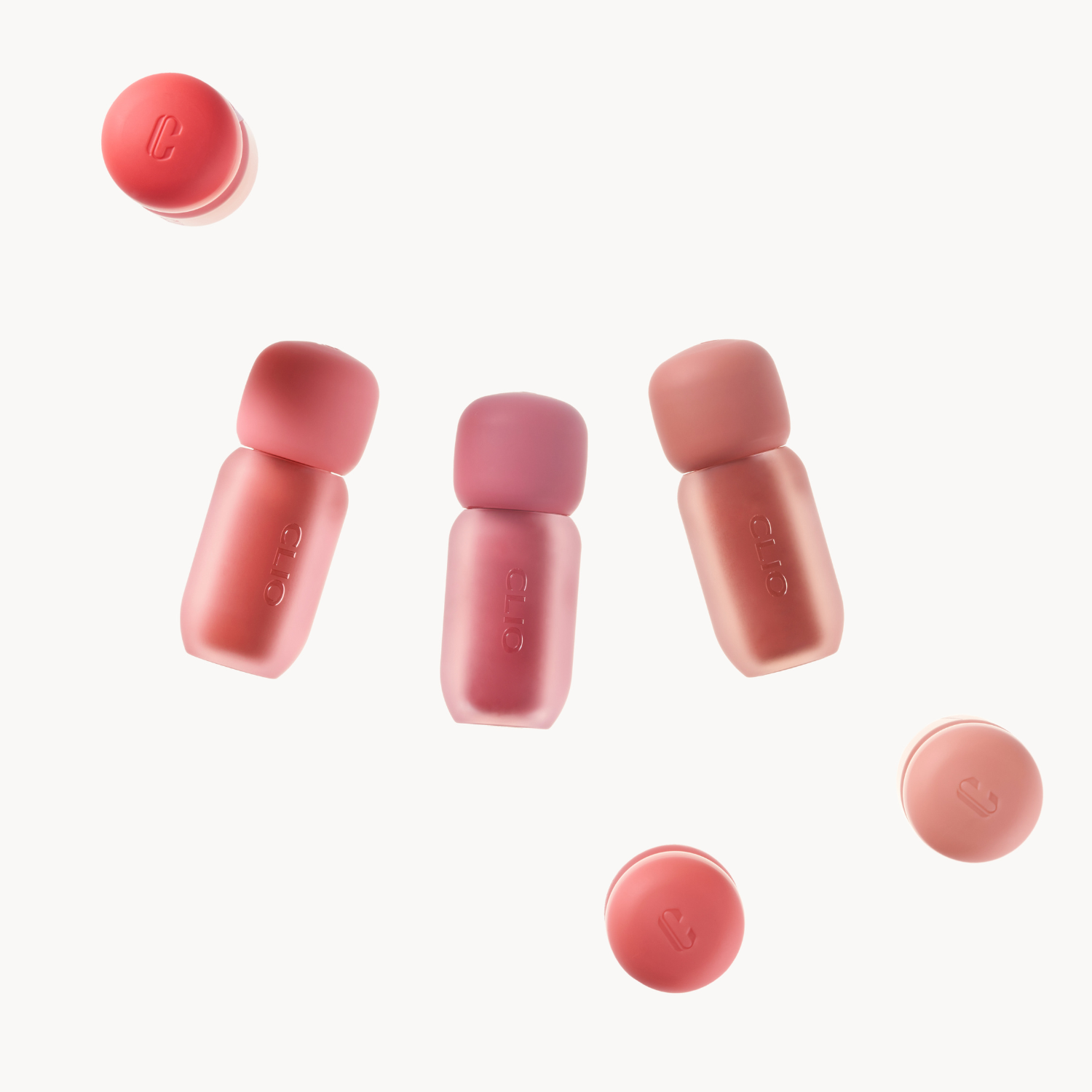 Clio Volumate Blur Tint lip tint in 8 shades, showing the variety of natural-looking lip color options and packaging.