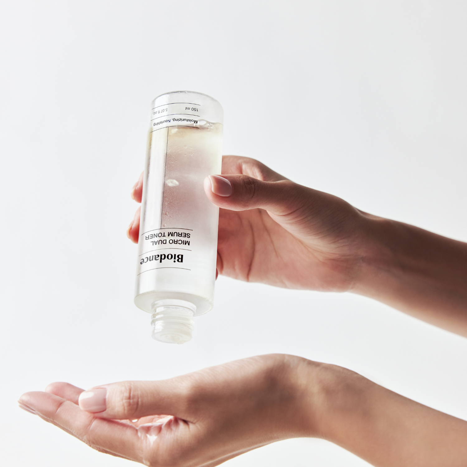 Biodance Micro Dual Serum Toner in 150ml bottle, showing clear liquid with a sleek design and label on the front.