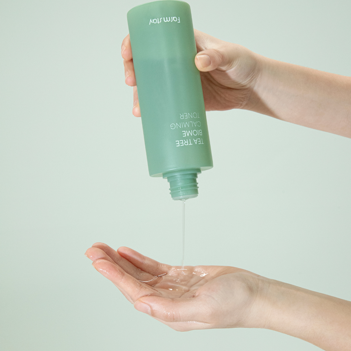 Farmstay Tea Tree Biome Calming Toner in a 200ml bottle, showing clear liquid and minimalist label on a white background.