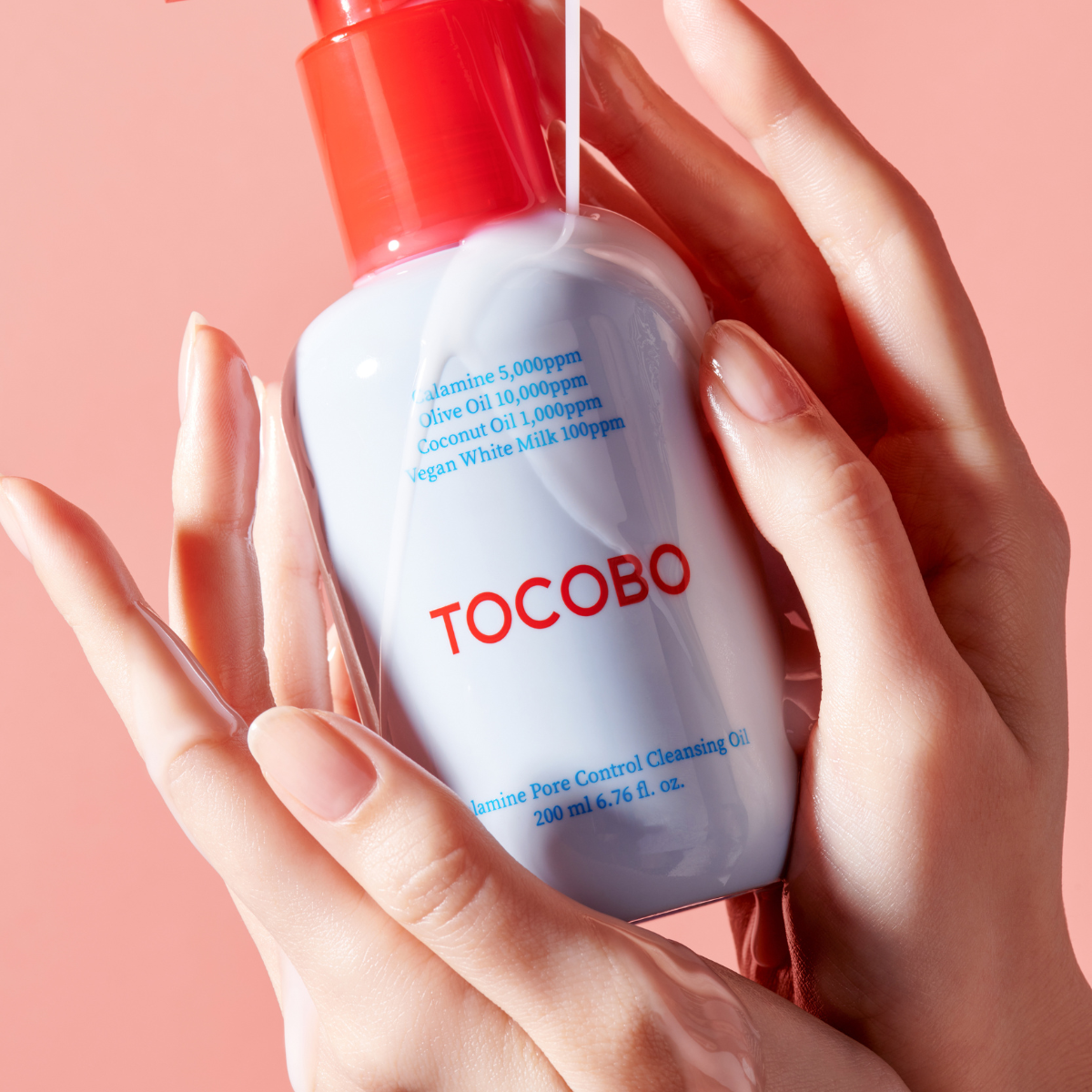 TOCOBO Calamine Pore Control Cleansing Oil in a 200ml bottle, showing the oil cleanser with a pump dispenser and clear liquid inside.