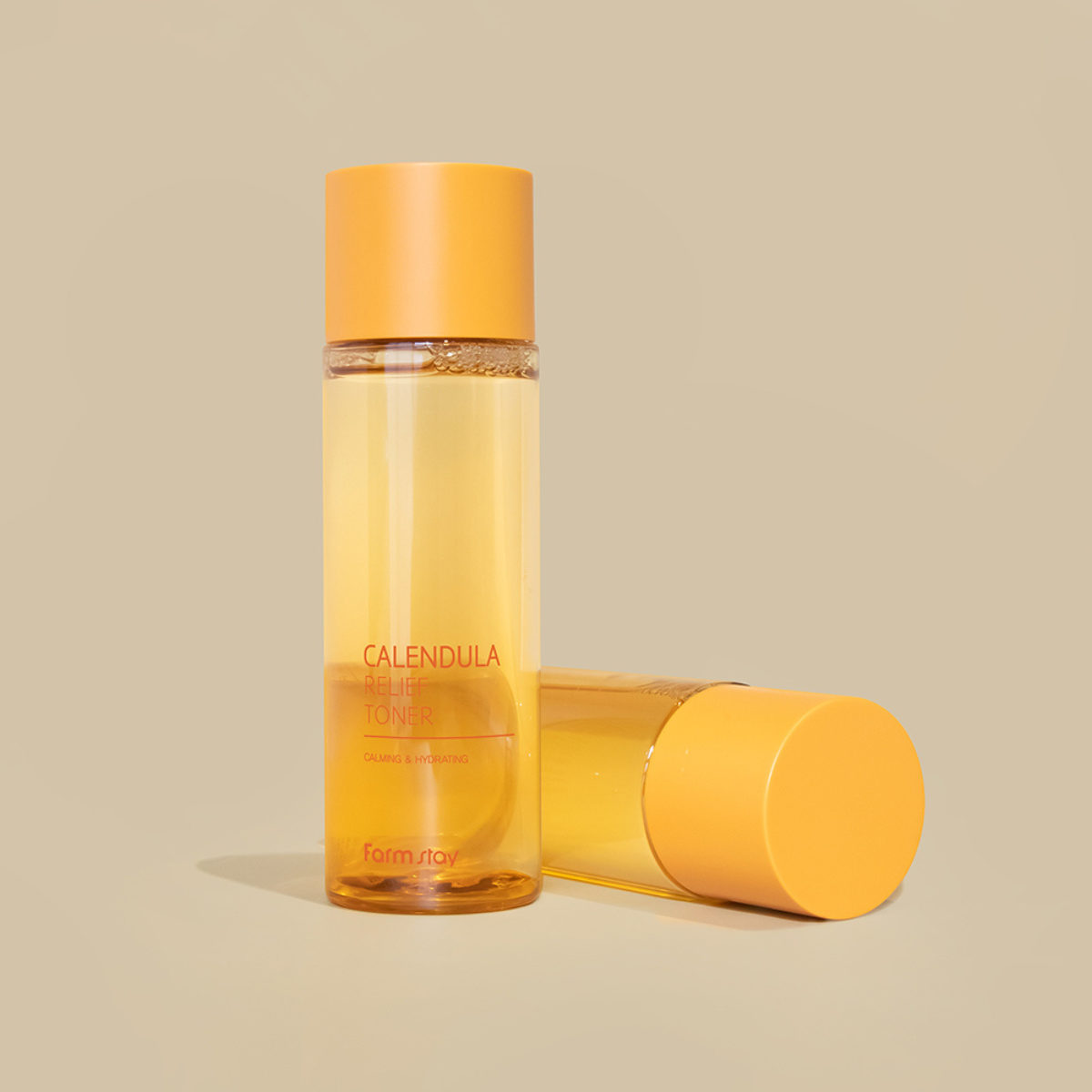 Farmstay Calendula Relief Toner 200ml bottle with label, clear liquid inside, and pump dispenser visible.