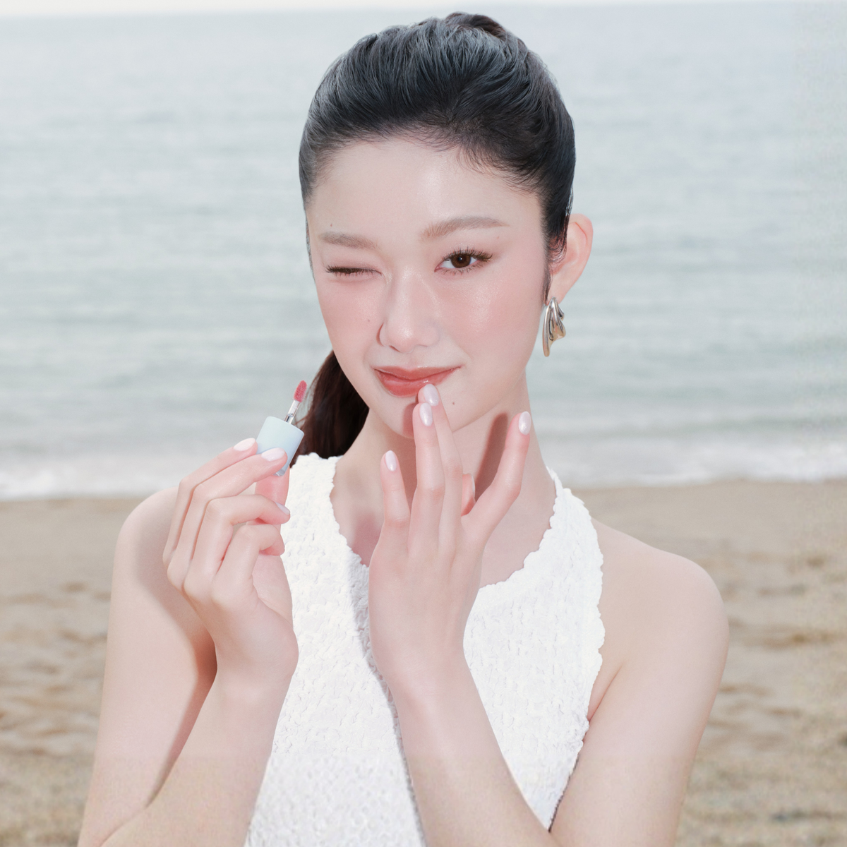 Hince Raw Glow Gel Tint Lip Tint in Chill Voyage Edition, showing the vibrant lip color and packaging.