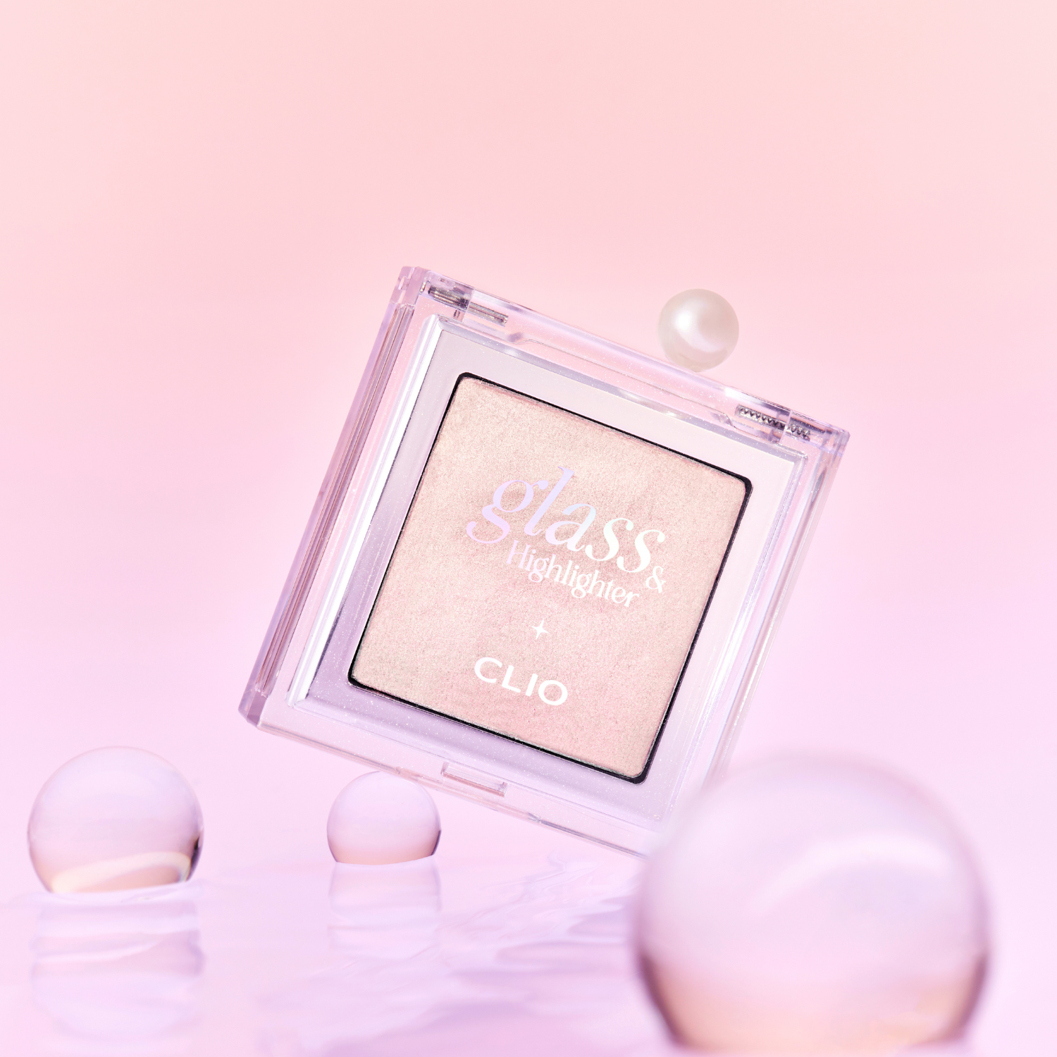 Clio Luxury Koshort Special Edition highlighter with glass applicator, featuring shimmering gold and pearl tones for radiant glow.