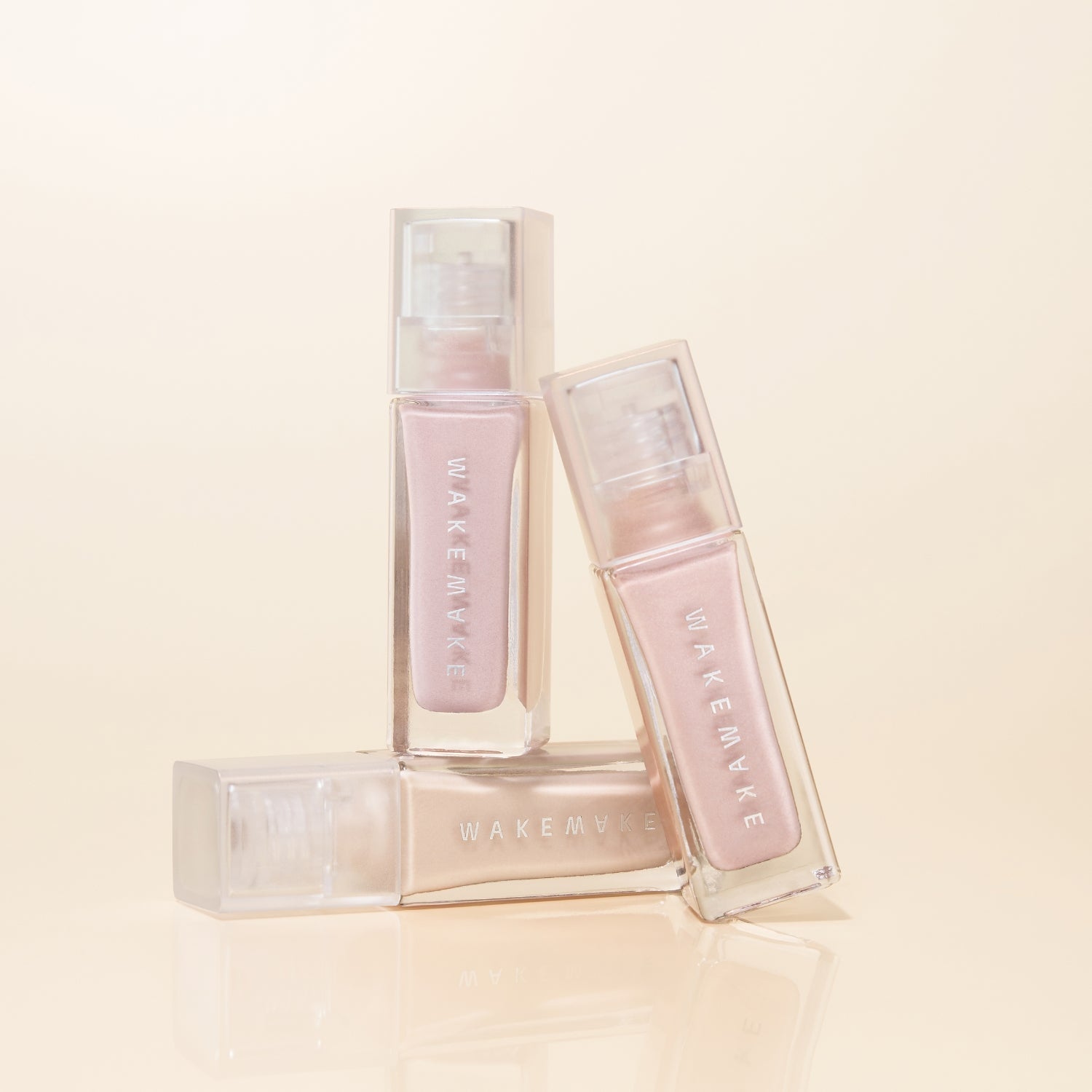 Wakemake Sheer Glow Liquid Highlighter with a luminous, dewy finish in a sleek bottle, perfect for adding radiance to the skin.