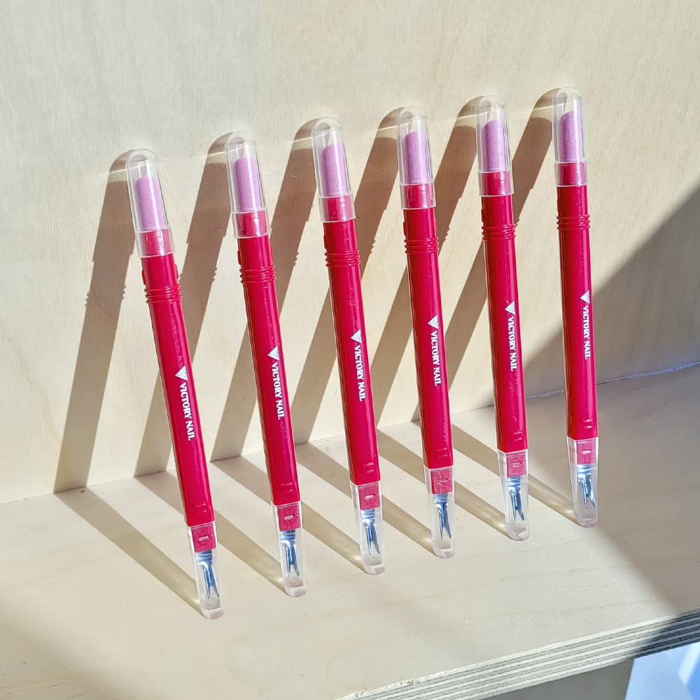 Two Victory Nail ceramic trimmer pushers for beauty tools, featuring sleek design and precise application in a close-up image.
