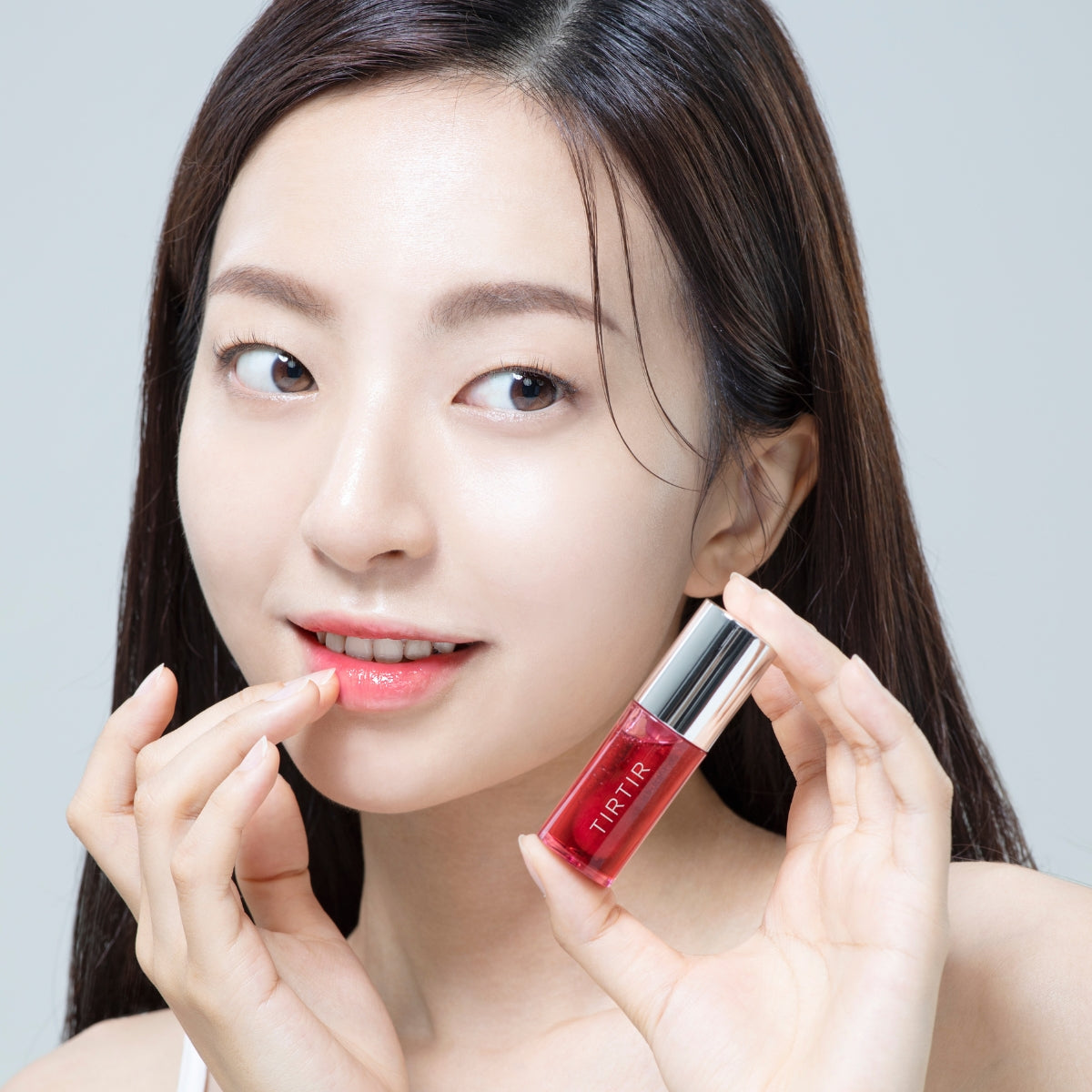 TIRTIR My Glow Lip Oil Rosy in 5.7ml, a glossy lip gloss with a rosy tint, featuring a sleek applicator and shiny finish.