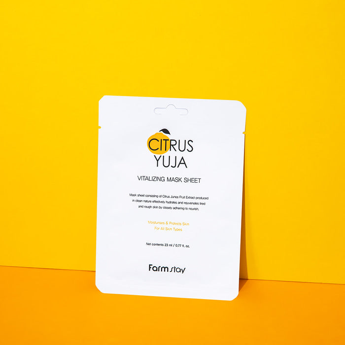 Farmstay Citrus Yuja Vitalizing Mask Sheet laid flat, showing the sheet mask with citrus fruit design and branding visible.