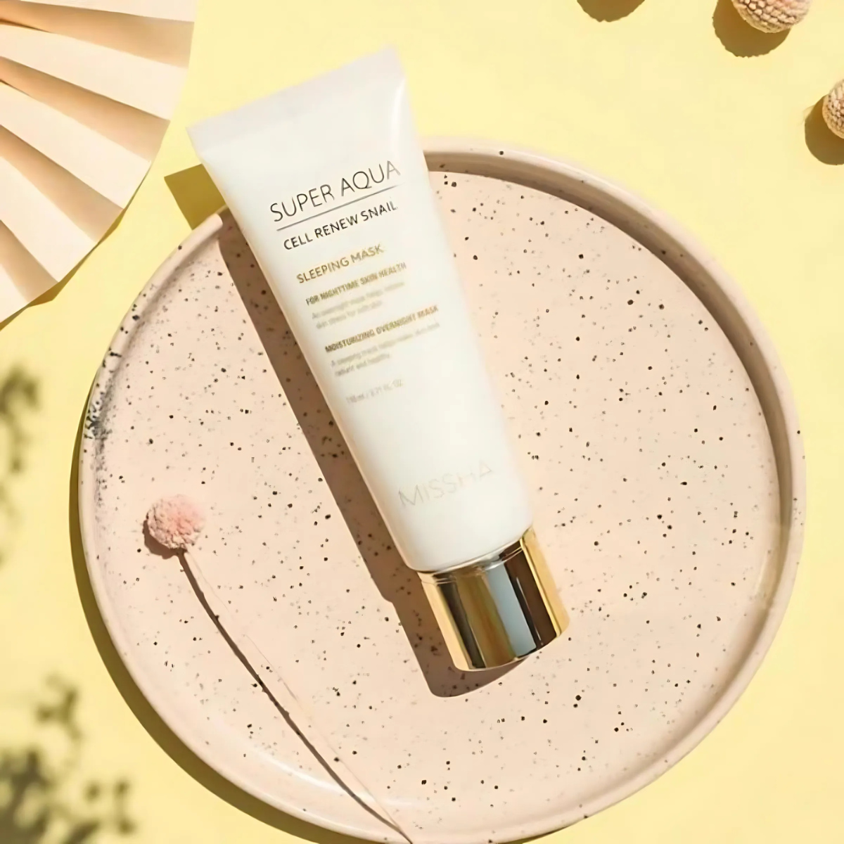 Missha Cell Renew Snail Sleeping Mask in a jar, hydrating leave-on skincare with snail extract for skin renewal and nourishment.