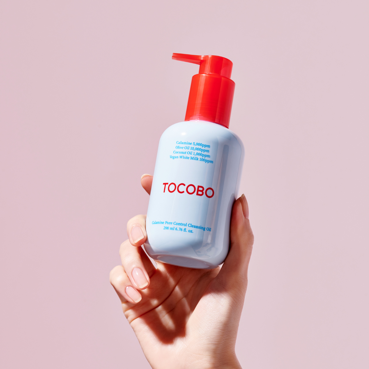 Calamine Pore Control Cleansing Oil by TOCOBO in a 200ml bottle, featuring a clear liquid with a pump dispenser for oil and balm cleansing.