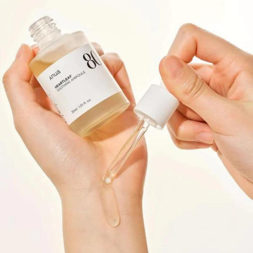 Anua Heartleaf 80% Ampoule in a 30ml bottle, featuring clear liquid and a white pump dispenser for skincare treatment.