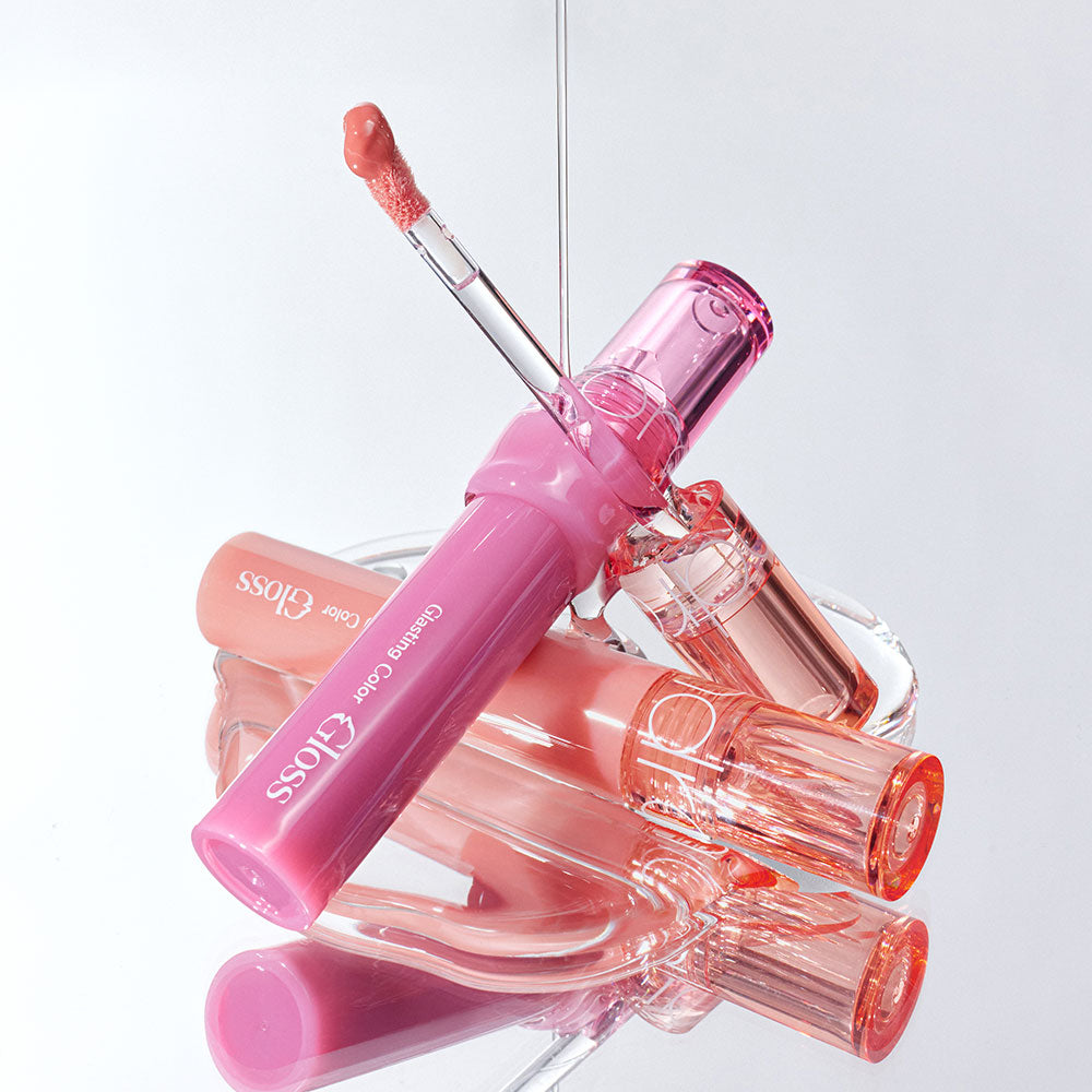 Rom&nd Glasting Color Gloss lip gloss in 8 vibrant shades, with glossy finish and smooth applicator visible in the image.