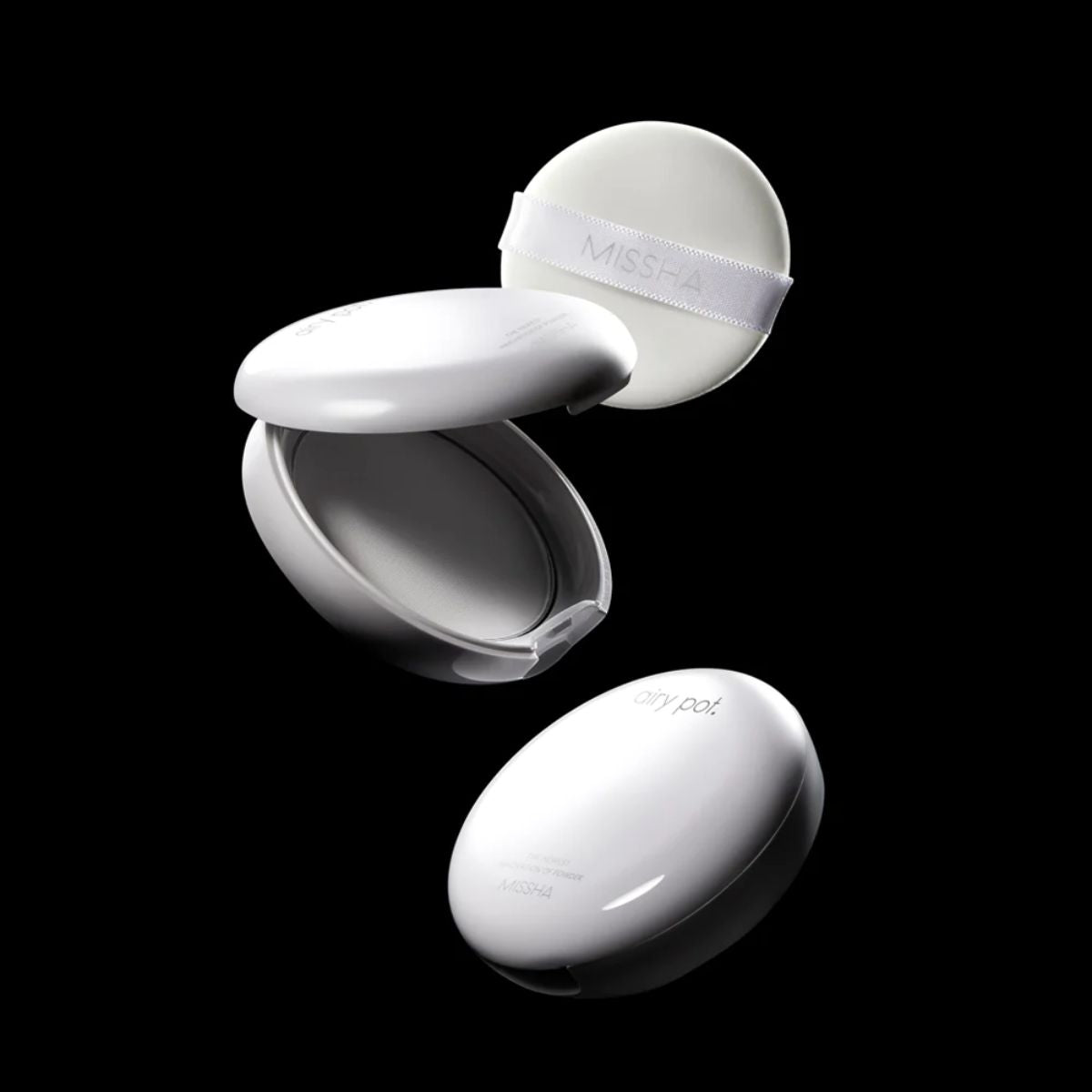 Missha Airy Pot Pressed Powder setting powder compact with soft, matte finish and smooth texture.