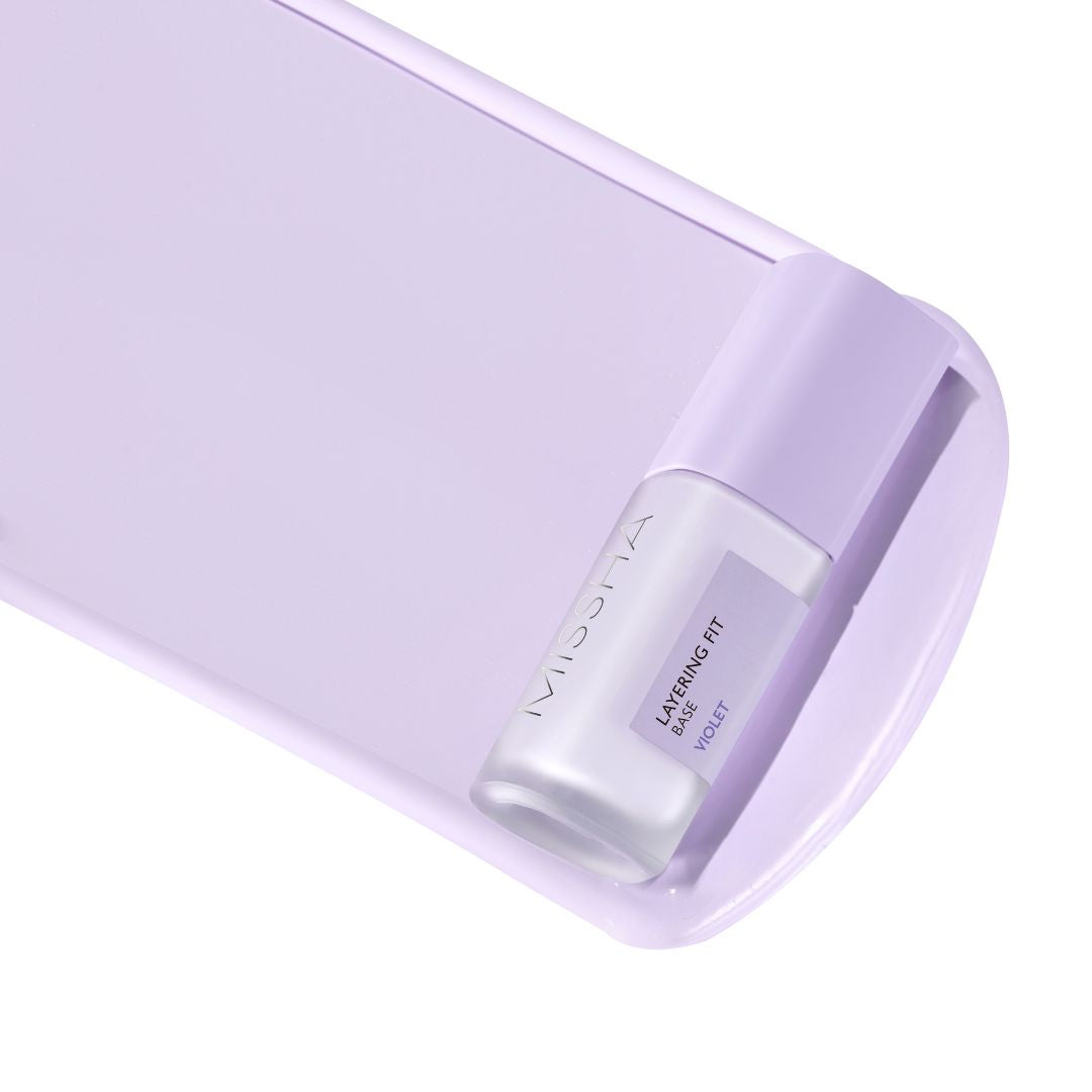 Missha Layering Fit Face Primer, a close-up of the lightweight primer in a sleek tube, designed to create a smooth makeup base.