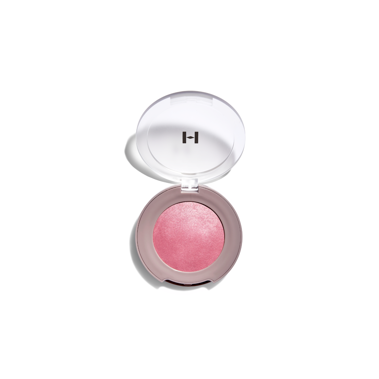 Hince True Dimension Glow Cheek blush in a soft pink shade, showing smooth, blendable powder texture on a neutral background.