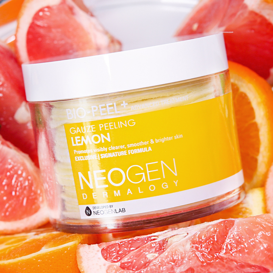 NEOGEN Lemon Bright PHA Gauze Peeling exfoliant, showing textured gauze pads soaked in bright yellow lemon-infused solution.