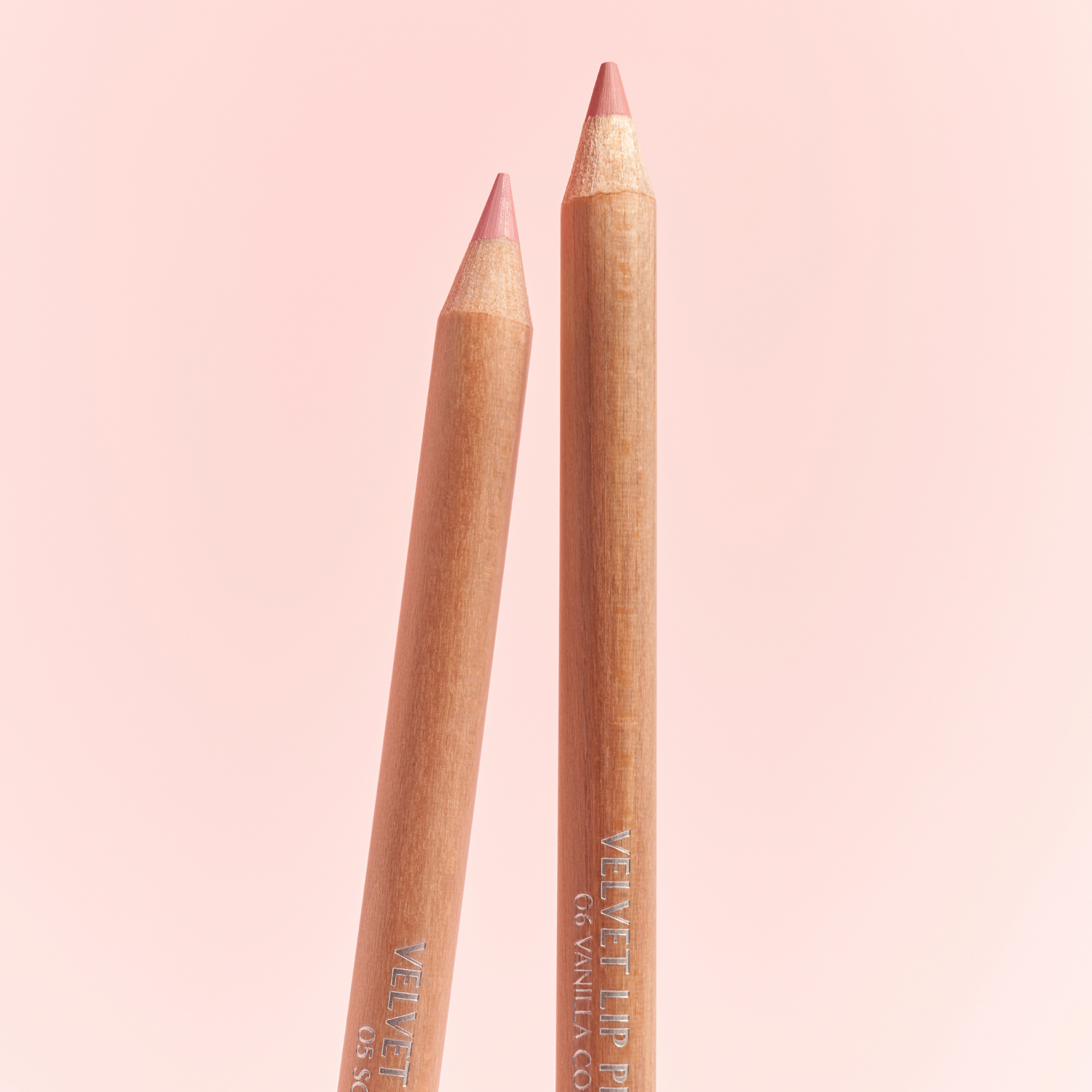 Clio Velvet Lip Pencil Set featuring seven lip liner pencils in various shades, with sleek black and gold packaging.