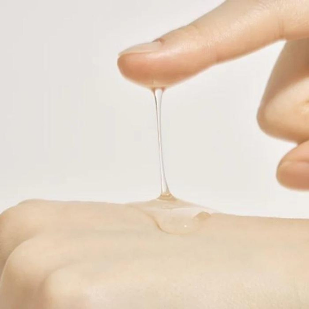 Anua Heartleaf 80% Ampoule 30ml in a clear glass bottle with a white pump, featuring a green and white label.