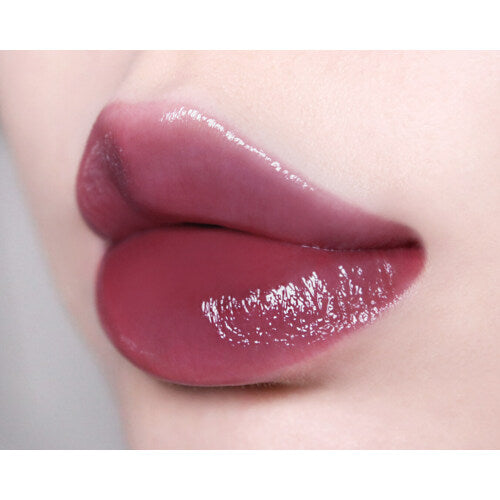 Too Cool For School Artclass Clair Tint lip tint in a sleek tube, showcasing the vibrant color and modern packaging.