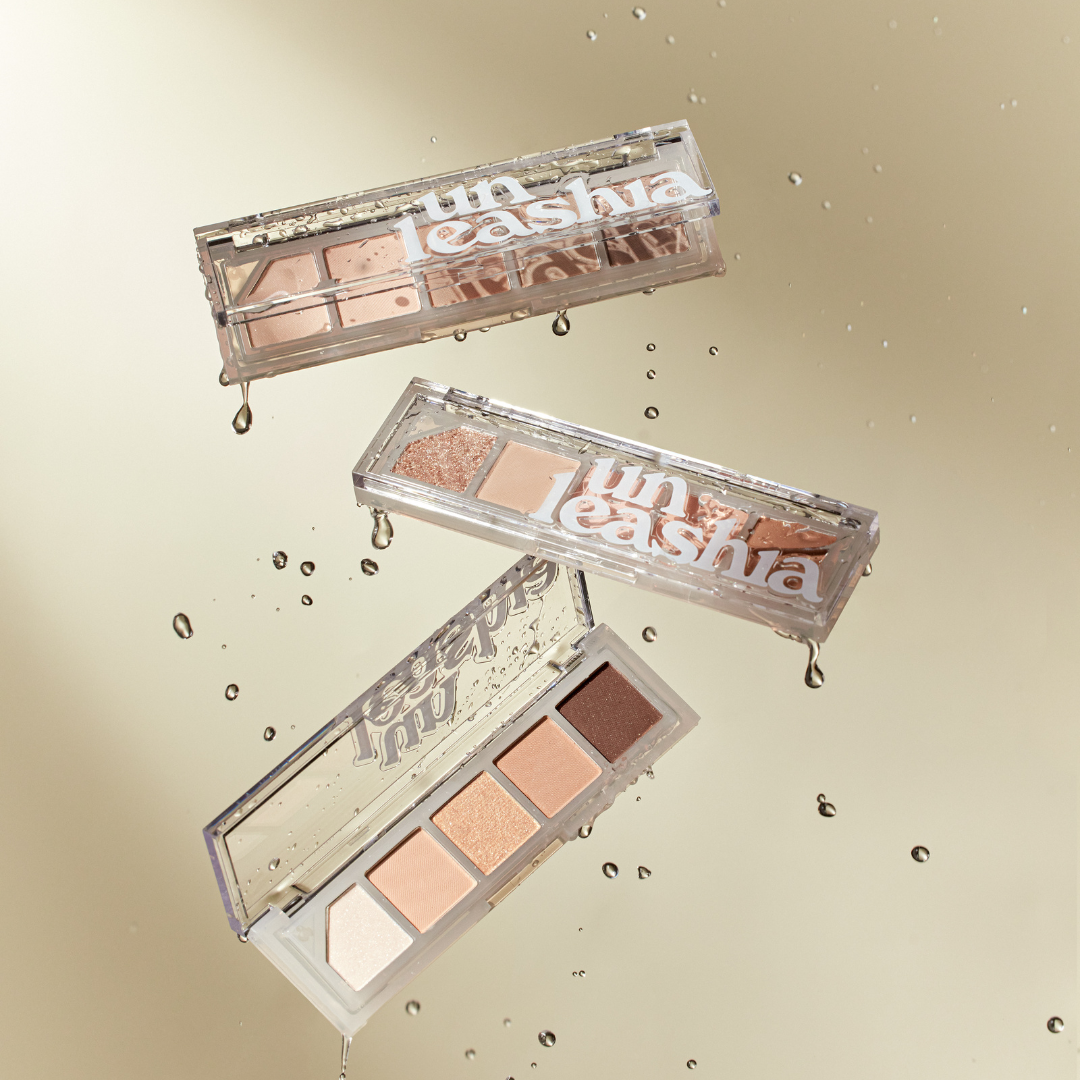 Unleashia Mood Shower Eyeshadow Palette with colorful shades and mirror, featuring a sleek compact design.