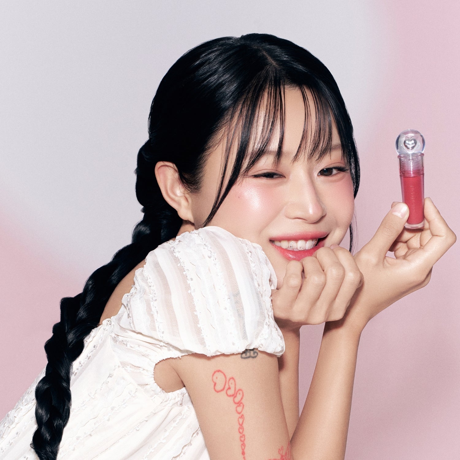 Peripera Ink Jellable Lip Tint in a vibrant shade, showcasing the glossy, gel-like texture and smooth application on lips.