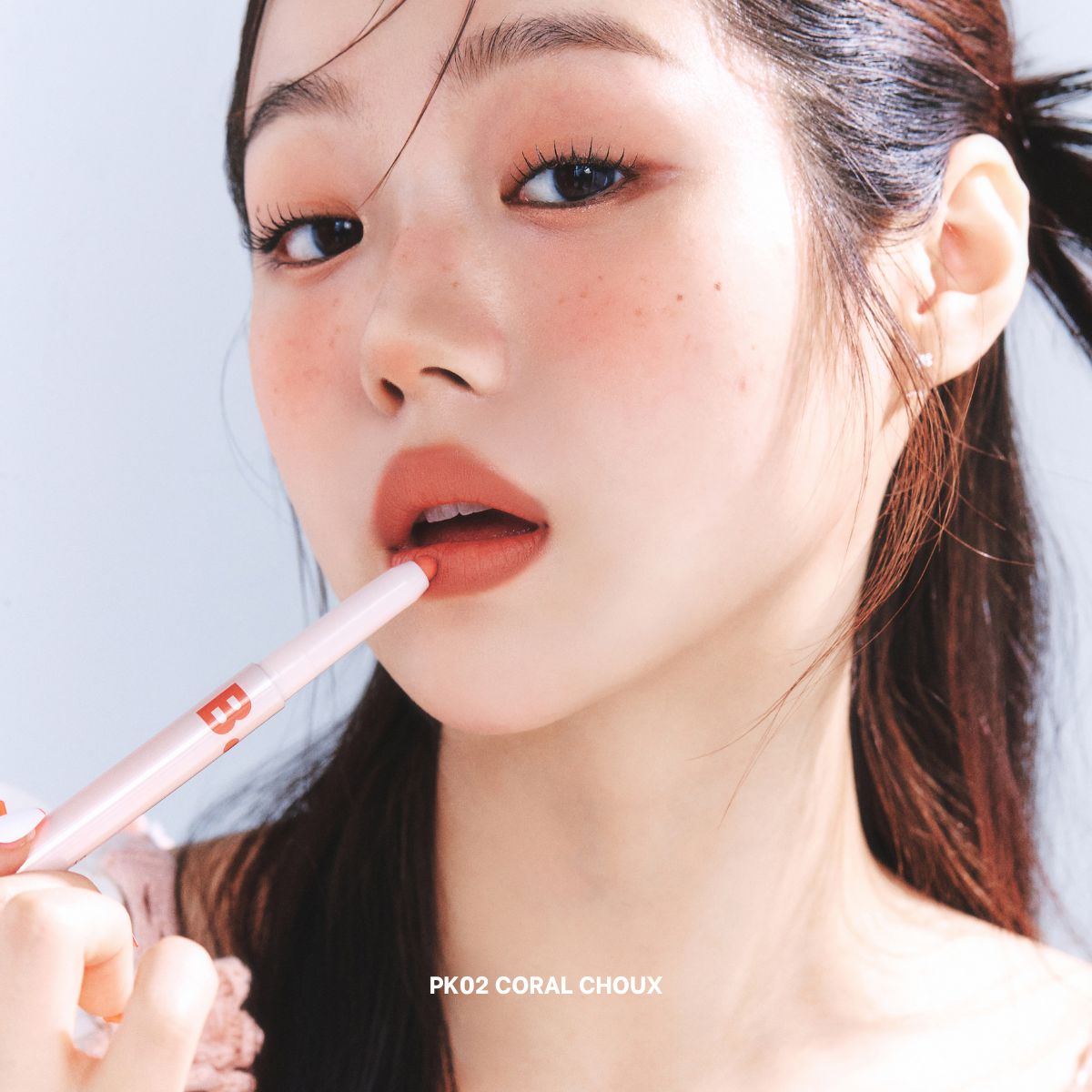 Banila Co B. By Banila Smudging Lip Pencil lip liner in a natural shade, shown with the pencil and swatched on skin.