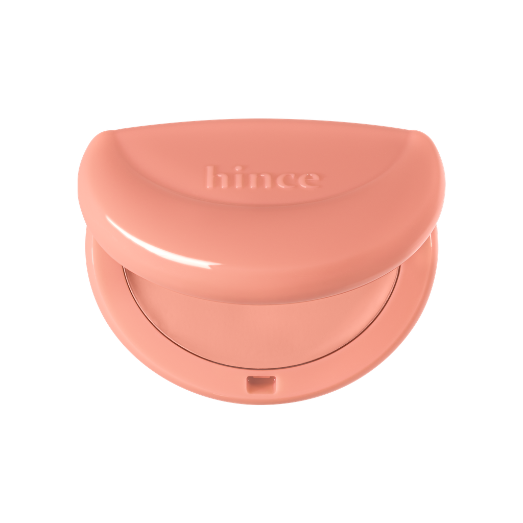 Hince Half-Moon Cheek Cream to Powder Blush in soft pink, showcasing the blush's smooth, blendable texture on the skin.