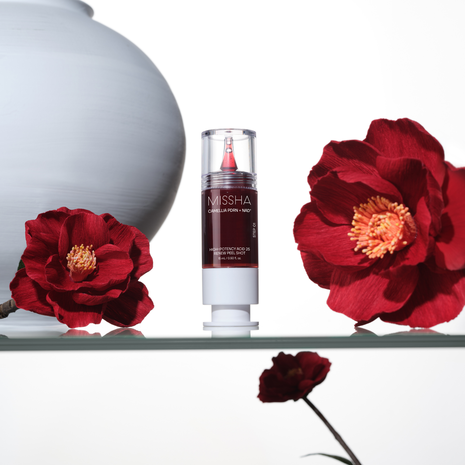 Missha PDRN Nad Renew Peel Shot 15ml ampoule with clear liquid in a small glass bottle, featuring a white dropper cap.
