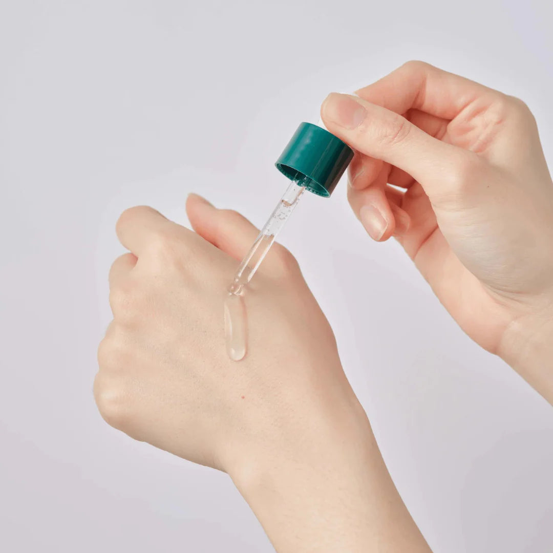 Round Lab Pine Calming Cica Ampoule 30ml bottle, featuring a clear glass container with a dropper cap, designed for soothing skincare.