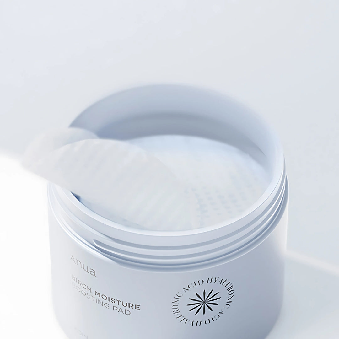 Anua Birch Moisture Boosting Toner Pad with 70 pads, showing a close-up of the skincare pads in a container.