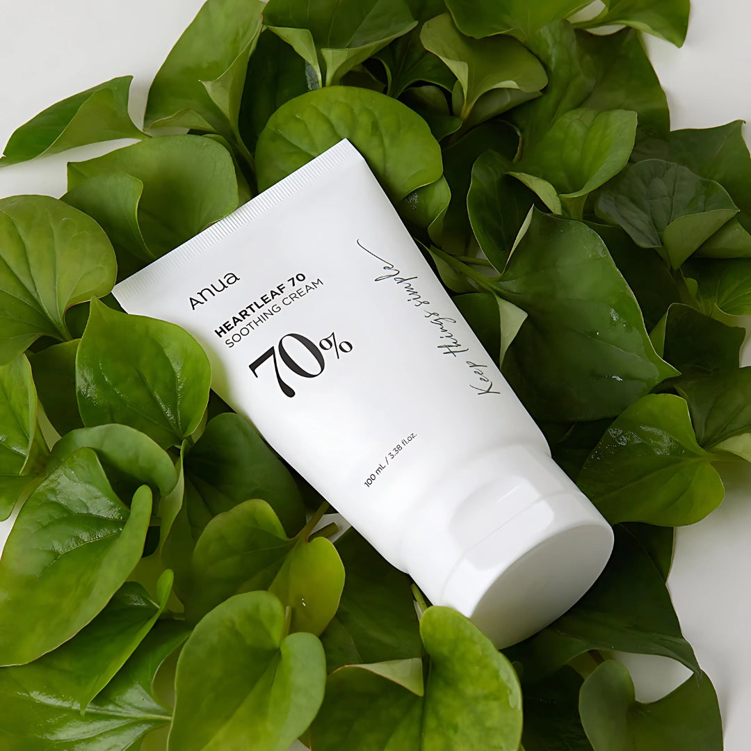 Anua Heartleaf 70% Soothing Cream face moisturizer in 100ml jar, with a creamy texture and herbal ingredients visible.