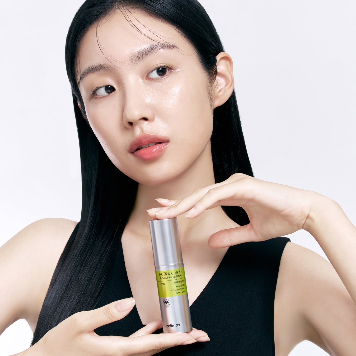 Celimax Vita-a Retinol Shot Tightening Serum 30ml being applied to face and throat for skin firming and rejuvenation.