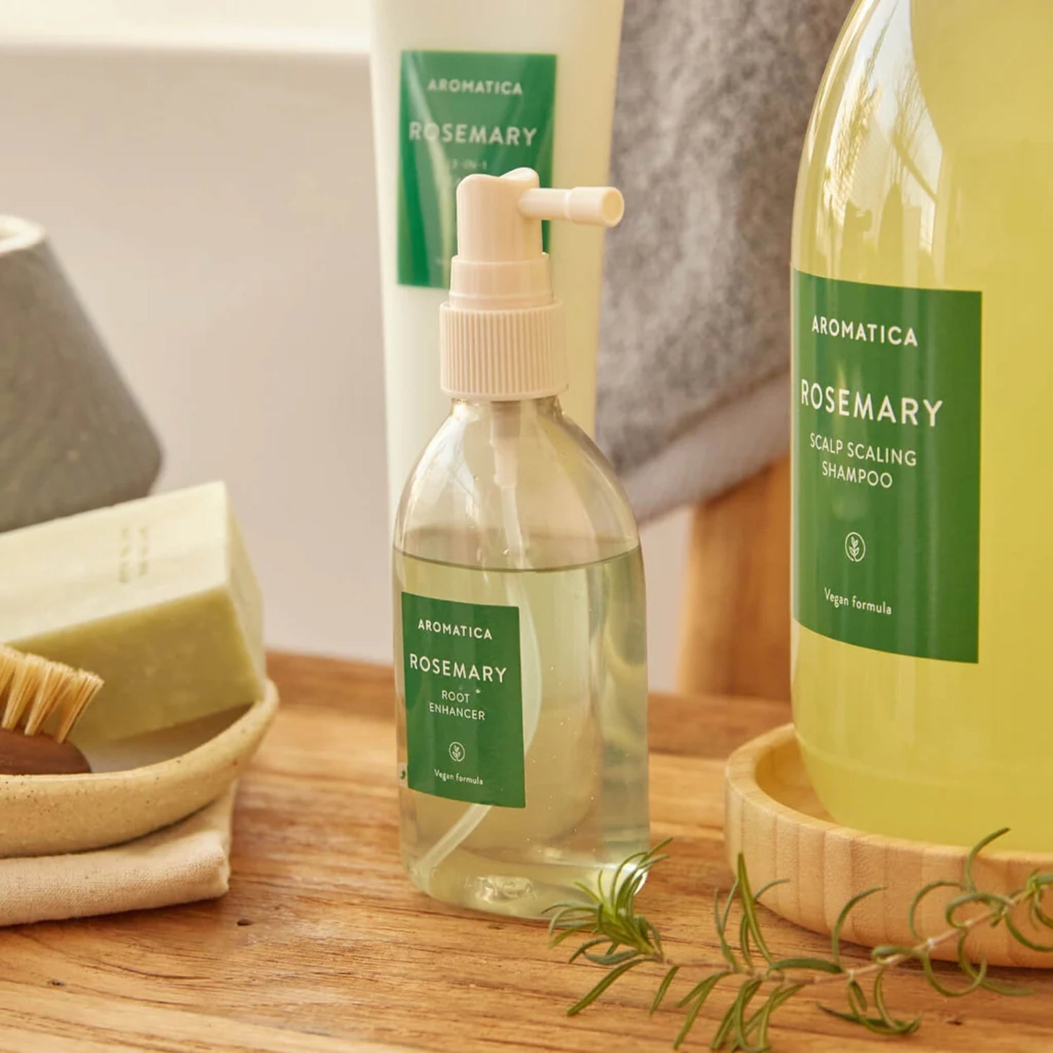 Aromatica Rosemary Root Enhancer 100ml conditioner and treatment bottle with herbal rosemary ingredients for healthy hair roots.