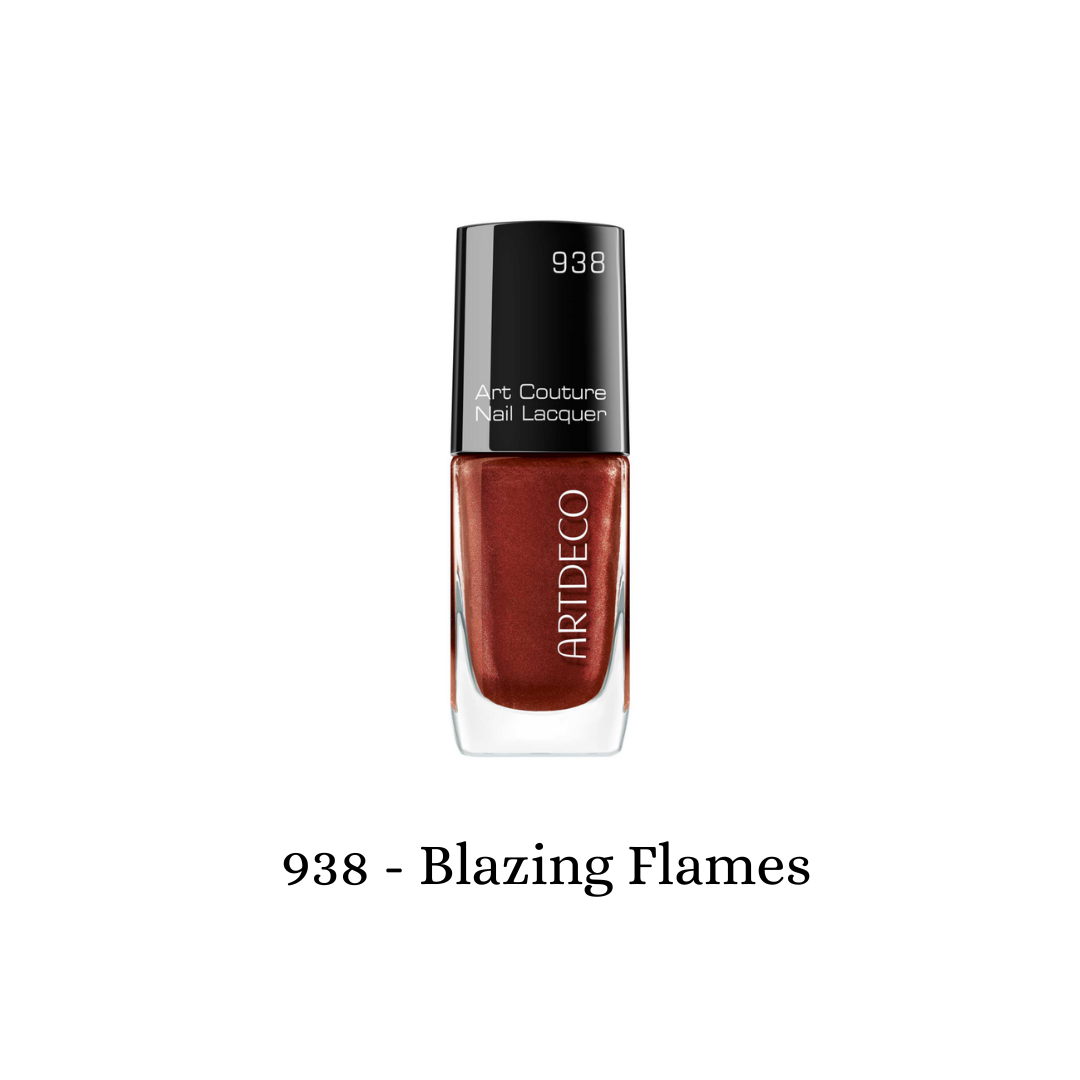 ARTDECO Art Couture Nail Lacquer in Blazing Flames with vibrant orange and red nail polish on neatly manicured nails.