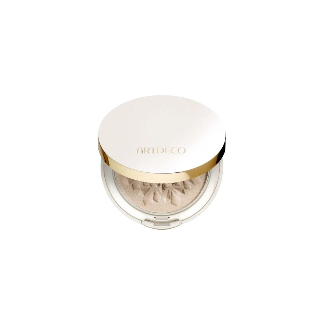 ARTDECO Glow Highlighting Powder in a sleek compact, featuring a shimmering highlighter with a reflective surface and embossed design.