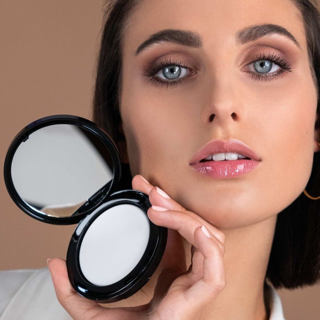 Transparent no color setting powder by ARTDECO, showing a loose, finely milled powder in a clear container.