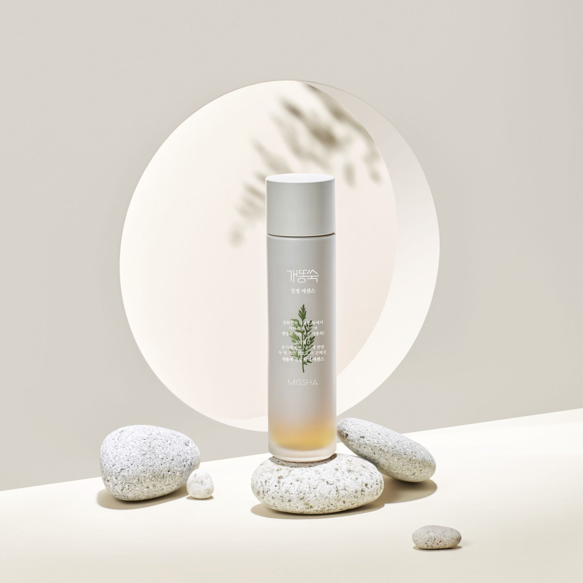 Missha Artemisia Calming Essence in a 150ml bottle, featuring herbal ingredients for soothing and calming skin care.