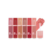 Banila Co Sheer Velvet Veil Lip Tint in a sleek tube, showcasing a soft, natural lip color with a smooth, velvety finish.