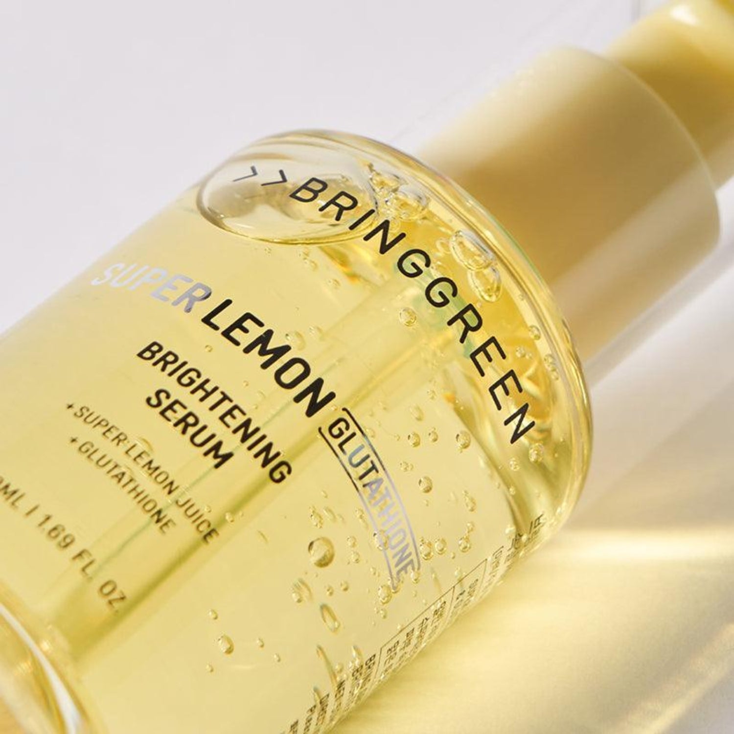 Bring Green Super Lemon Glutathione Brightening Serum Set with 50ml bottle and night activator, featuring citrus-infused skincare.