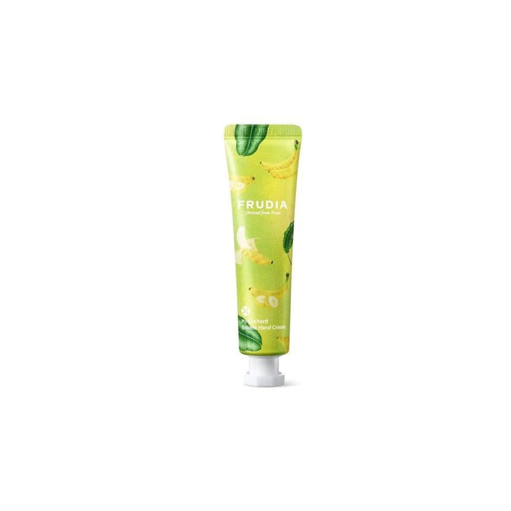 Frudia My Orchard Hand Cream with banana extract, showing a tube of nourishing hand cream and a ripe banana on a white background.