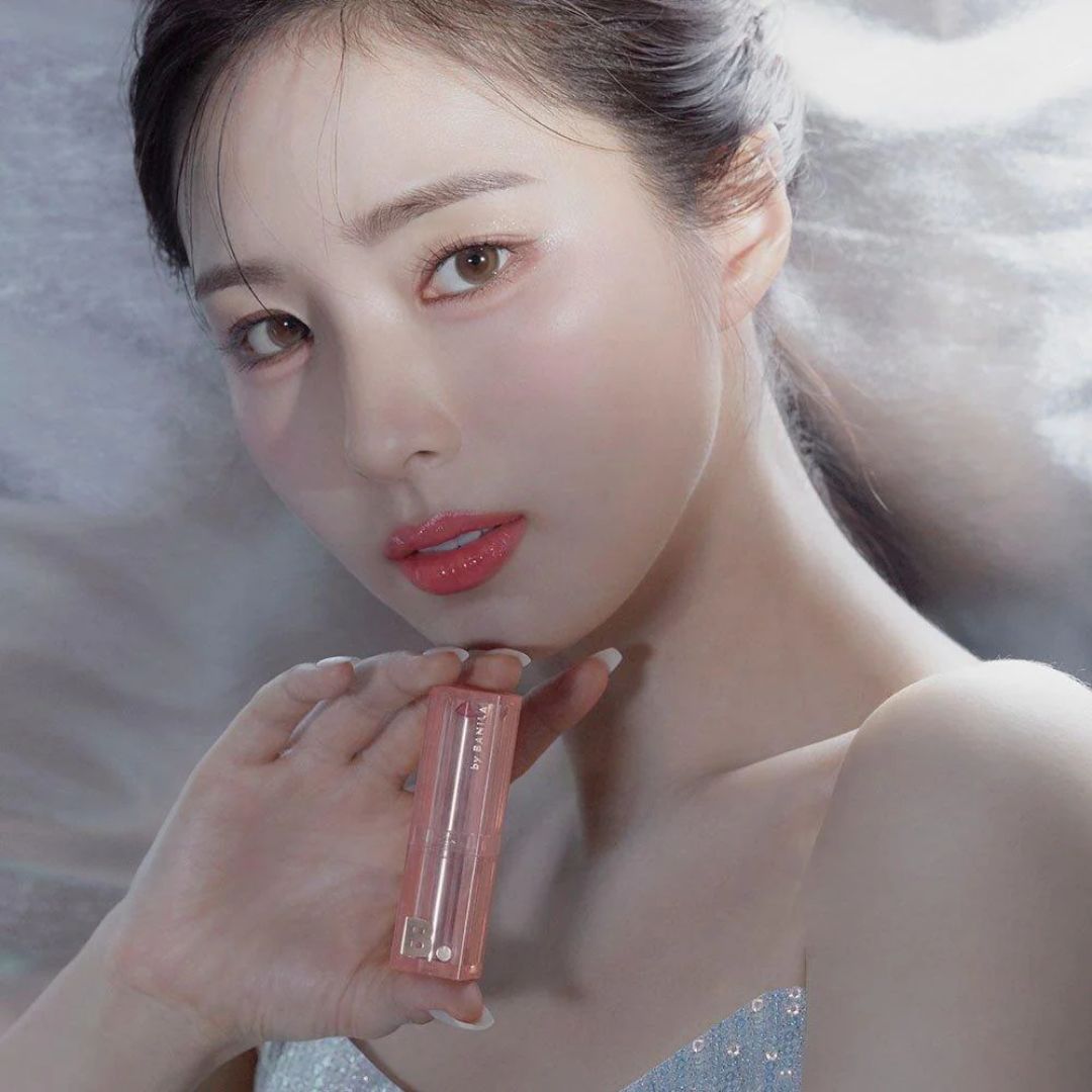 Banila Co Glow Veil Lipstick in a sleek tube with a close-up of the lipstick bullet showing a soft, luminous shade.